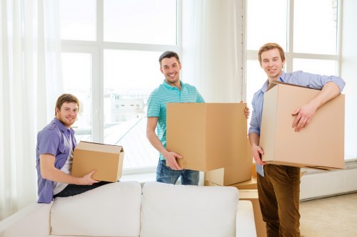 Safety-focused movers planning access and lifting before collection