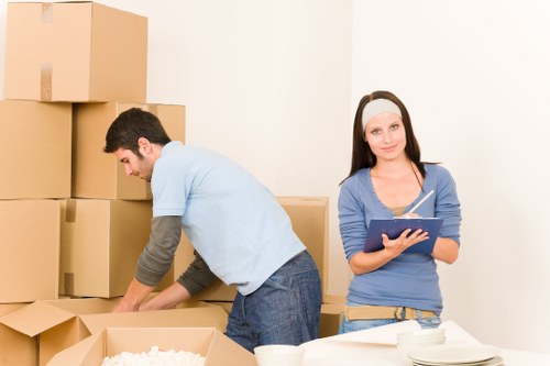 Packed office boxes and desks ready for a move in a Pimlico commercial property