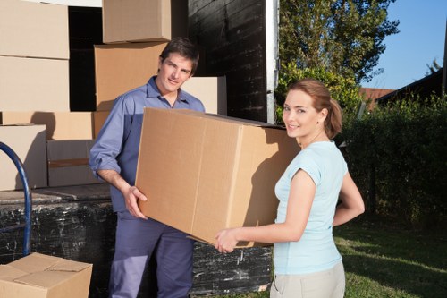 Professional movers navigating a Pimlico street with loading access